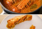 Queue de langouste à l'armoricaine prête à être dégustée, parfumée aux épices marines.
