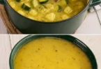 Bol de soupe de courgettes garnie de crème fraîche et herbes