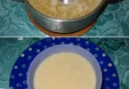 Bol de velouté de radis noir garni de crème et herbes fraîches